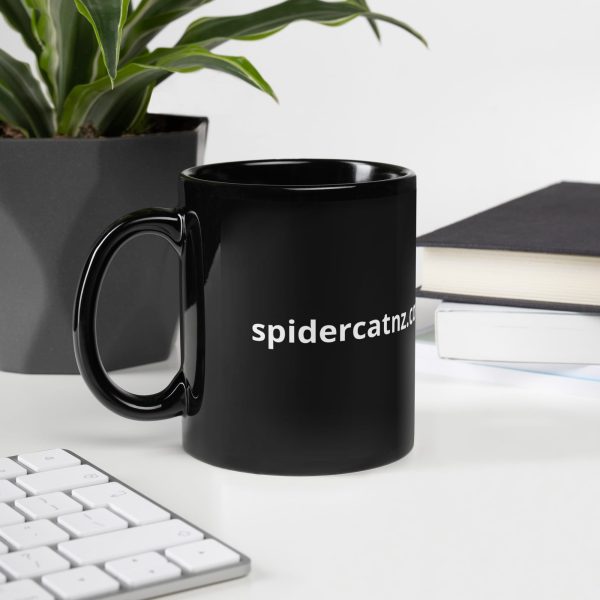 The Cat is Back Black Glossy Mug